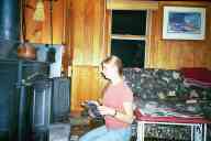 (The Farm, Thanksgiving 2001) Katie feeding the fire?
