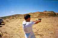 (Shooting at chez Maly, August 2002) Adam Brown shoots Glock