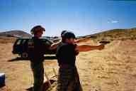 (Shooting at chez Maly, August 2002) Jen Swan shoots E.G. Makarov