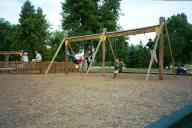 (Playing in Denver, August 2002) Sasha Garofalo, Jen Swan, Katie Condon, Abe Smith on swings at City Park