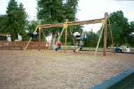 (Playing in Denver, August 2002) Sasha Garofalo, Jen Swan, Katie Condon, Abe Smith on swings at City Park