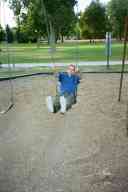(Playing in Denver, August 2002) Zak Smith on swing at City Park