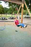 (Playing in Denver, August 2002) Sasha Garofalo on swing at City Park
