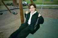 (Playing in Denver, August 2002) Jen Swan on swing at City Park