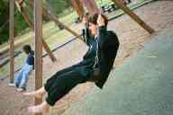 (Playing in Denver, August 2002) Jen Swan on swing at City Park