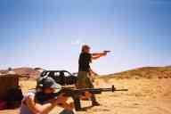 (Shooting at chez Maly, August 2002) Sasha Garofalo shoots M96 Rifle, Abe Smith shoots CZ-85 Combat