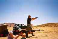 (Shooting at chez Maly, August 2002) Sasha Garofalo shoots M96 Rifle, Abe Smith shoots CZ-85 Combat