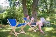 (The Farm, July 2002) Abe lounging reading a book