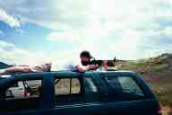(June 2003 Shutzenfest) Jason fires the AR-15 from the roof