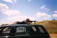 (June 2003 Shutzenfest) Zak shoots the AR-15 from car roof