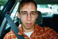 (Madison, July 2003) Zak in car looking greasy