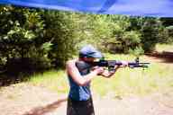 (Shooting at Farm, July 2003) Sasha shoots the AR-15 standing