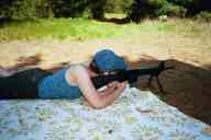 (Shooting at Farm, July 2003) Sasha shoots the AR-15 prone