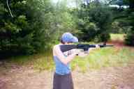 (Shooting at Farm, July 2003) Sasha shoots the AR-15 standing