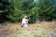 (Shooting at Farm, July 2003) Dad shoots the AR-15 kneeling