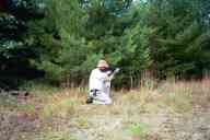 (Shooting at Farm, July 2003) Dad shoots the AR-15 kneeling