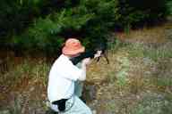 (Shooting at Farm, July 2003) Dad shoots the AR-15 kneeling