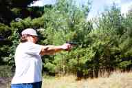 (Shooting at Farm, July 2003) Mom shoots the Dan Wesson 1911