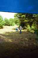 (Shooting at Farm, July 2003) Mom and Abe pick up brass